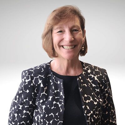 Smiling woman in patterned blazer