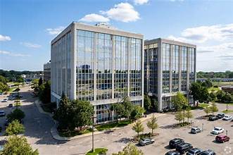 Modern office buildings with parking lot