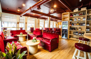 Modern wine bar with red velvet seating